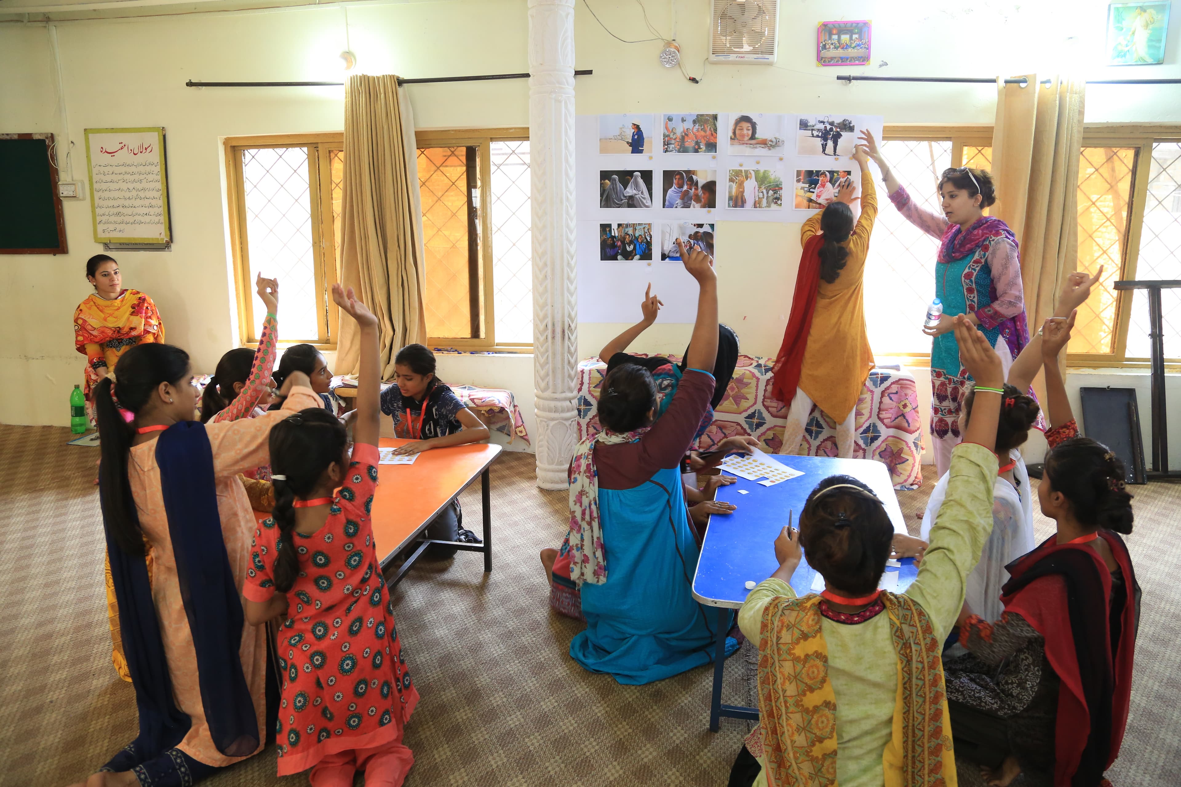 Girls collaborating on moodboards for Springster platform content