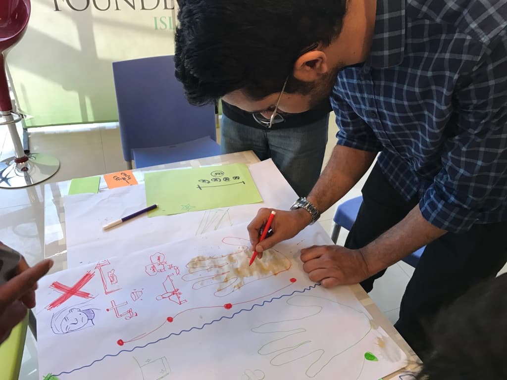 Mother-in-law and daughter-in-law together at a community health session